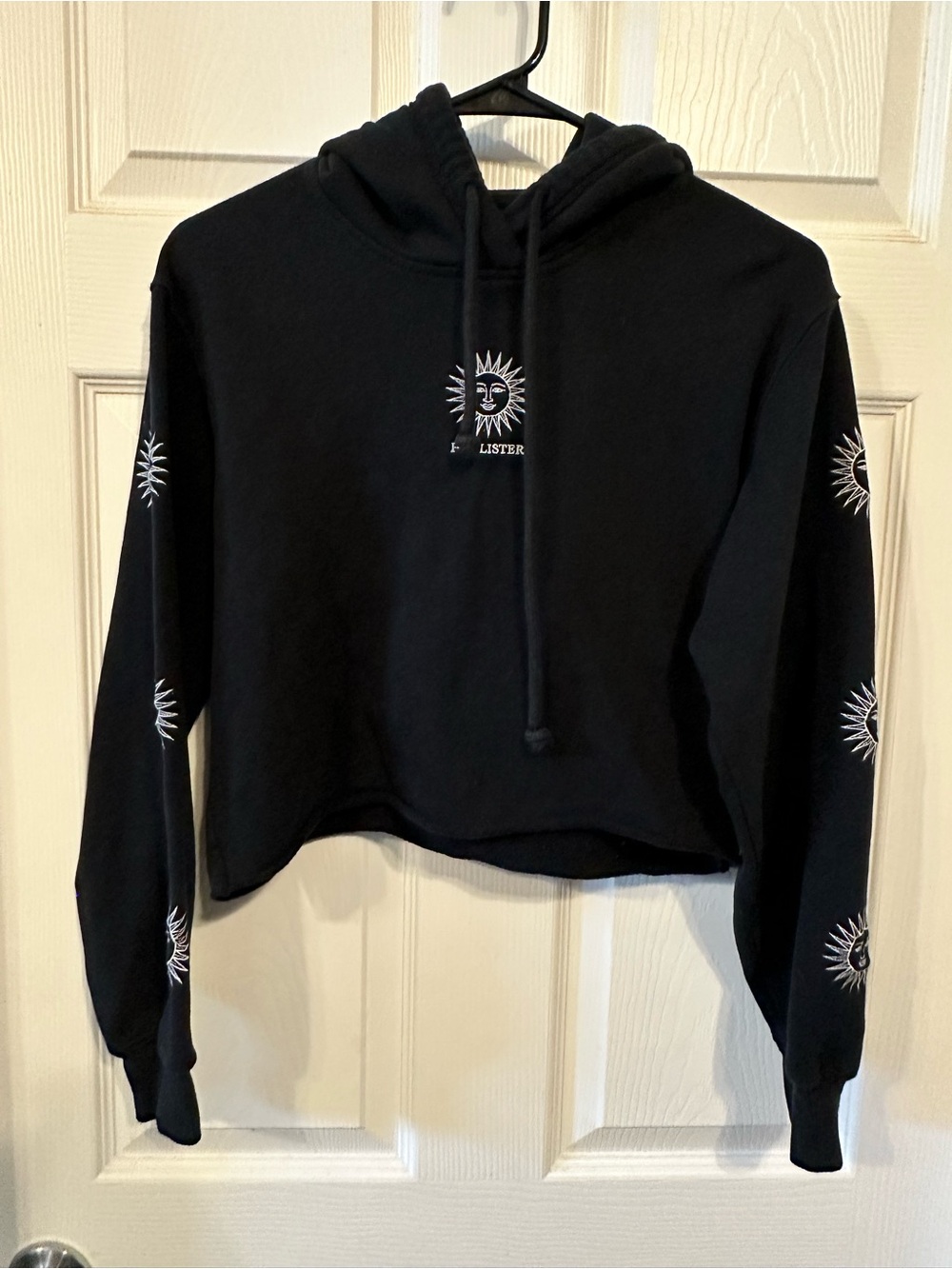 Hollister Black Cropped Hoodie with Celestial Sun Motif